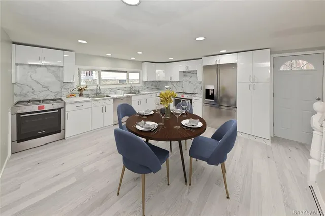 a living room with furniture flat screen tv and couches