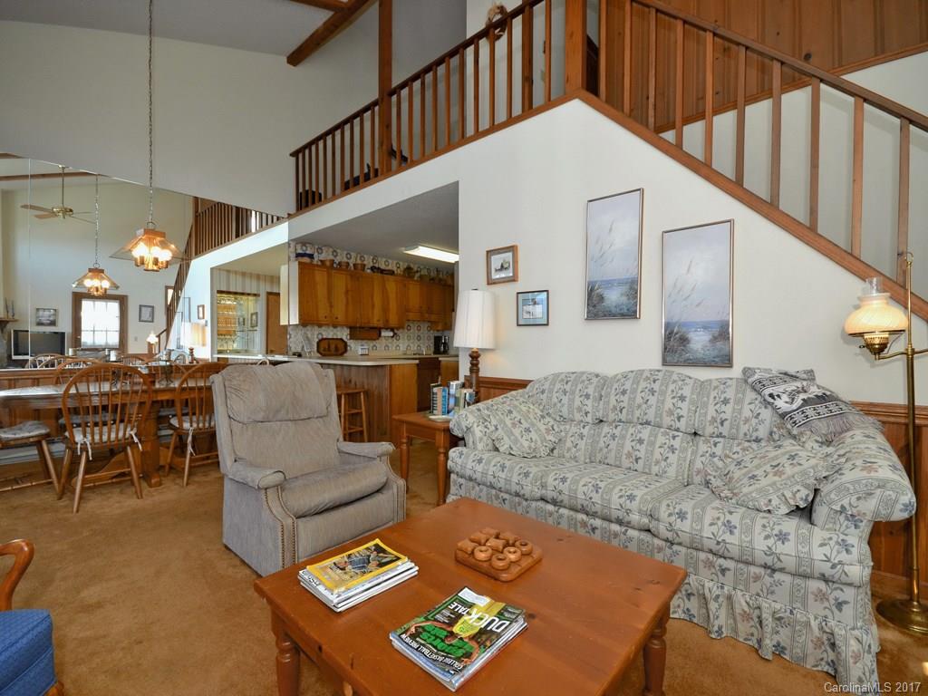600 Brandywine Road, Unit 8 Waynesville, NC 28786 - Photo 2 of 18 a living room with furniture and a table