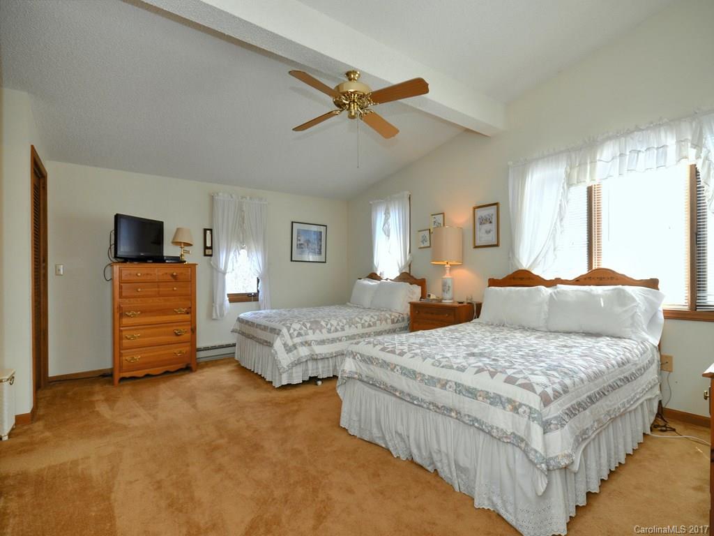 600 Brandywine Road, Unit 8 Waynesville, NC 28786 - Photo 11 of 18 a living room with furniture and a flat screen tv