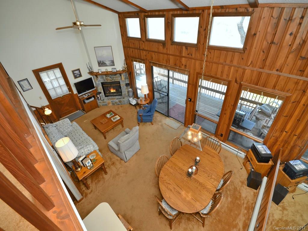 600 Brandywine Road, Unit 8 Waynesville, NC 28786 - Photo 14 of 18 a living room with furniture and a floor to ceiling window