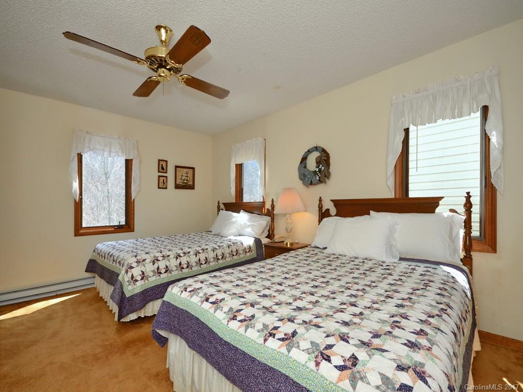 600 Brandywine Road, Unit 8 Waynesville, NC 28786 - Photo 10 of 18 a bedroom with two beds and a window
