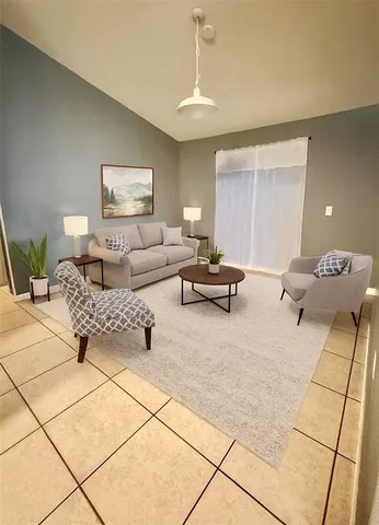 a living room with couch and a table