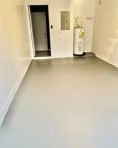 an empty room with a white wall