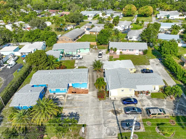 an aerial view of residential houses with outdoor space