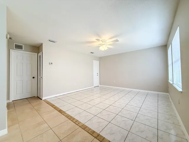 a view of an empty room and window