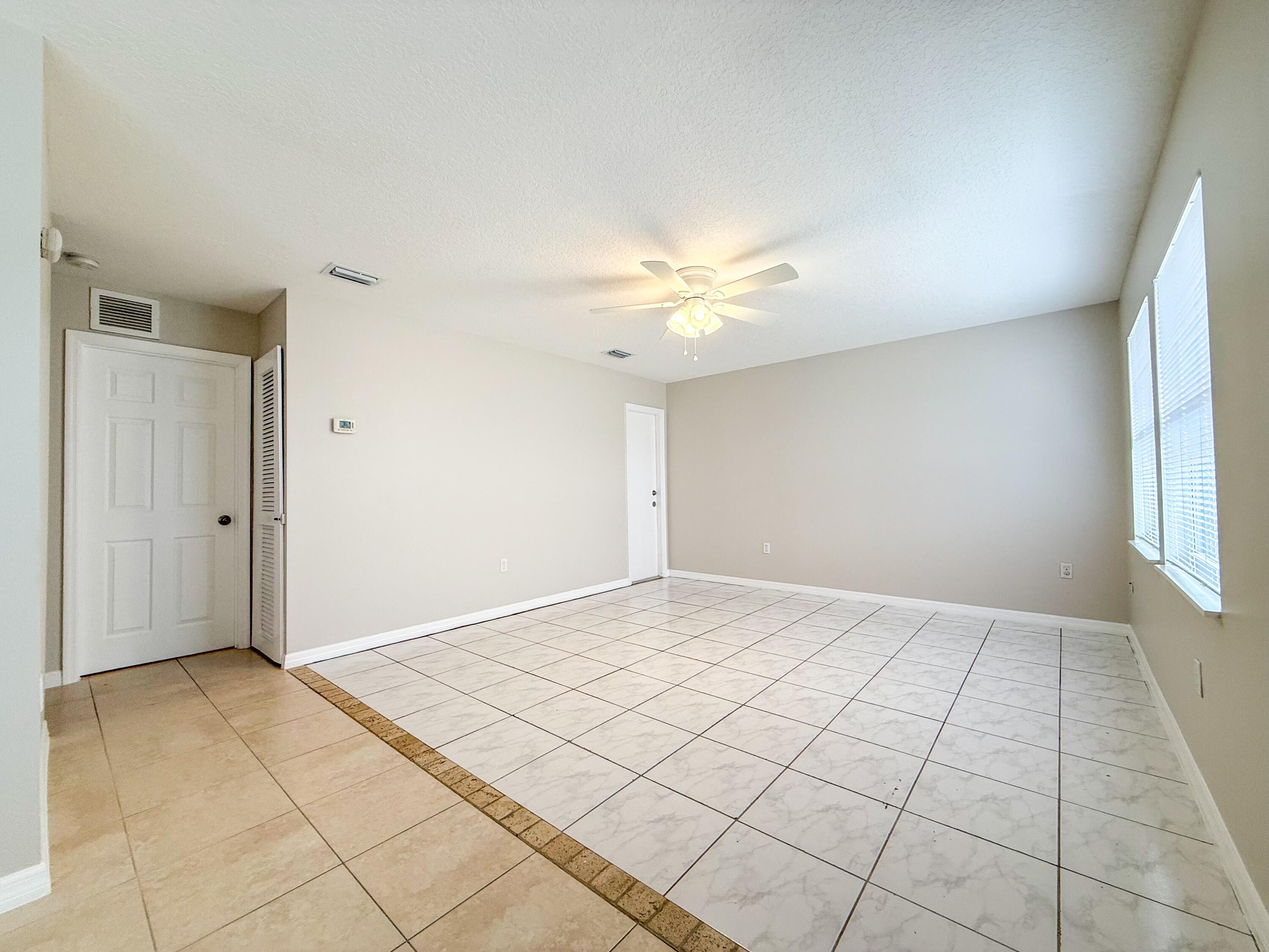 2719 Richard Road West Palm Beach, FL 33403 - Photo 3 of 14 a view of an empty room and window