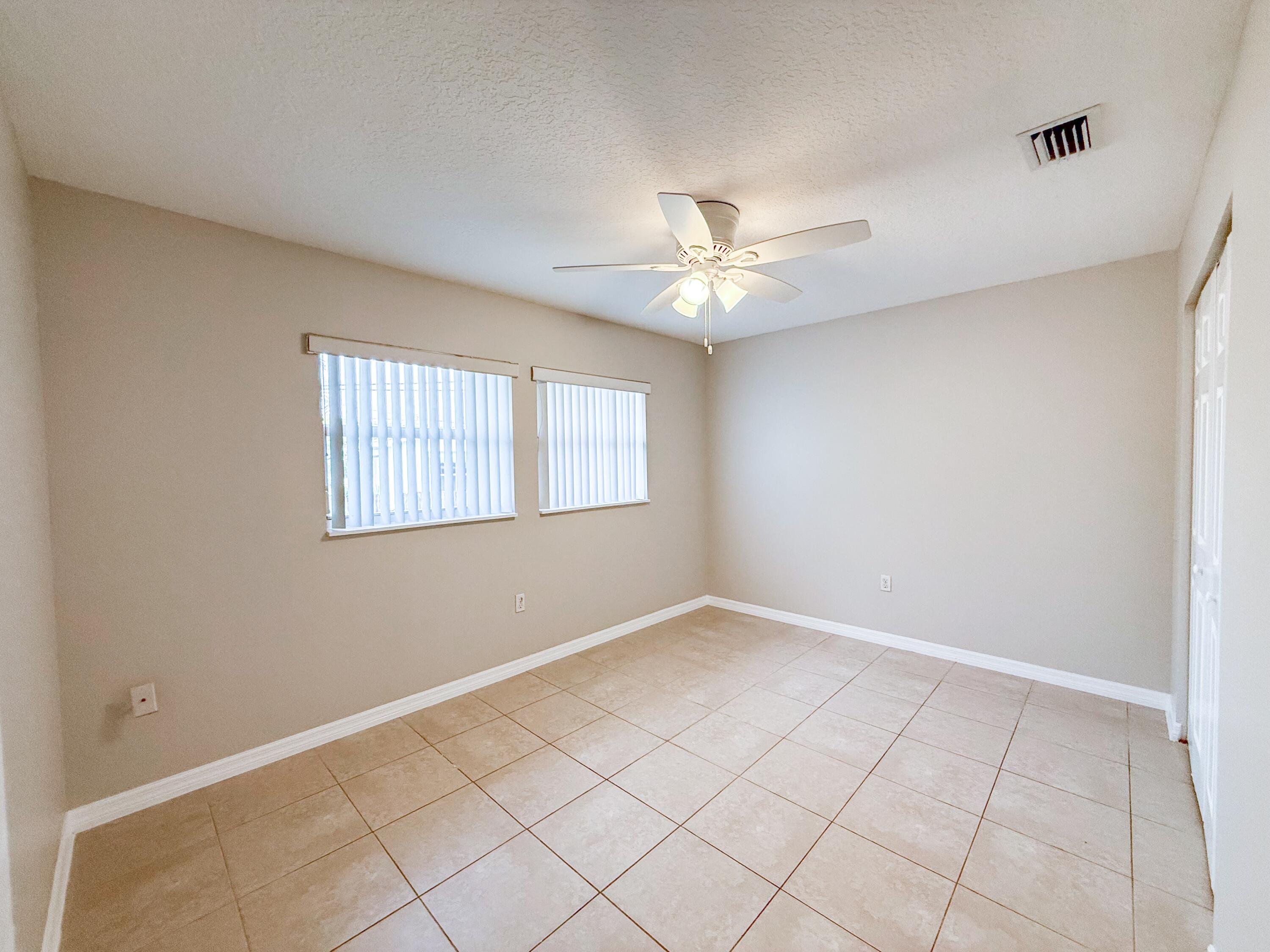 2719 Richard Road West Palm Beach, FL 33403 - Photo 6 of 14 a view of an empty room with a window