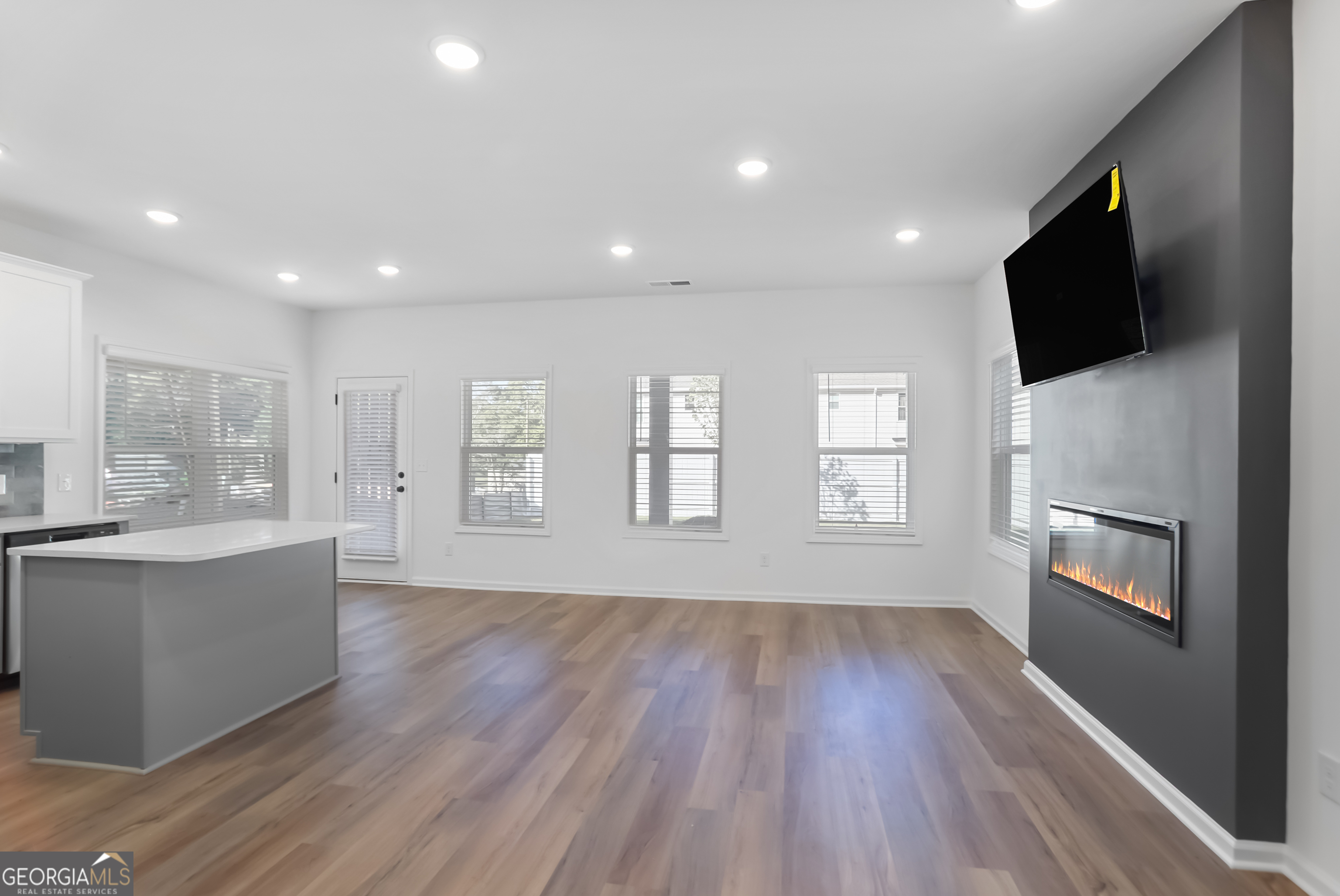 183 Jackson Heights, Unit 4 Cleveland, GA 30528 - Photo 4 of 28 Home includes an electric fireplace.