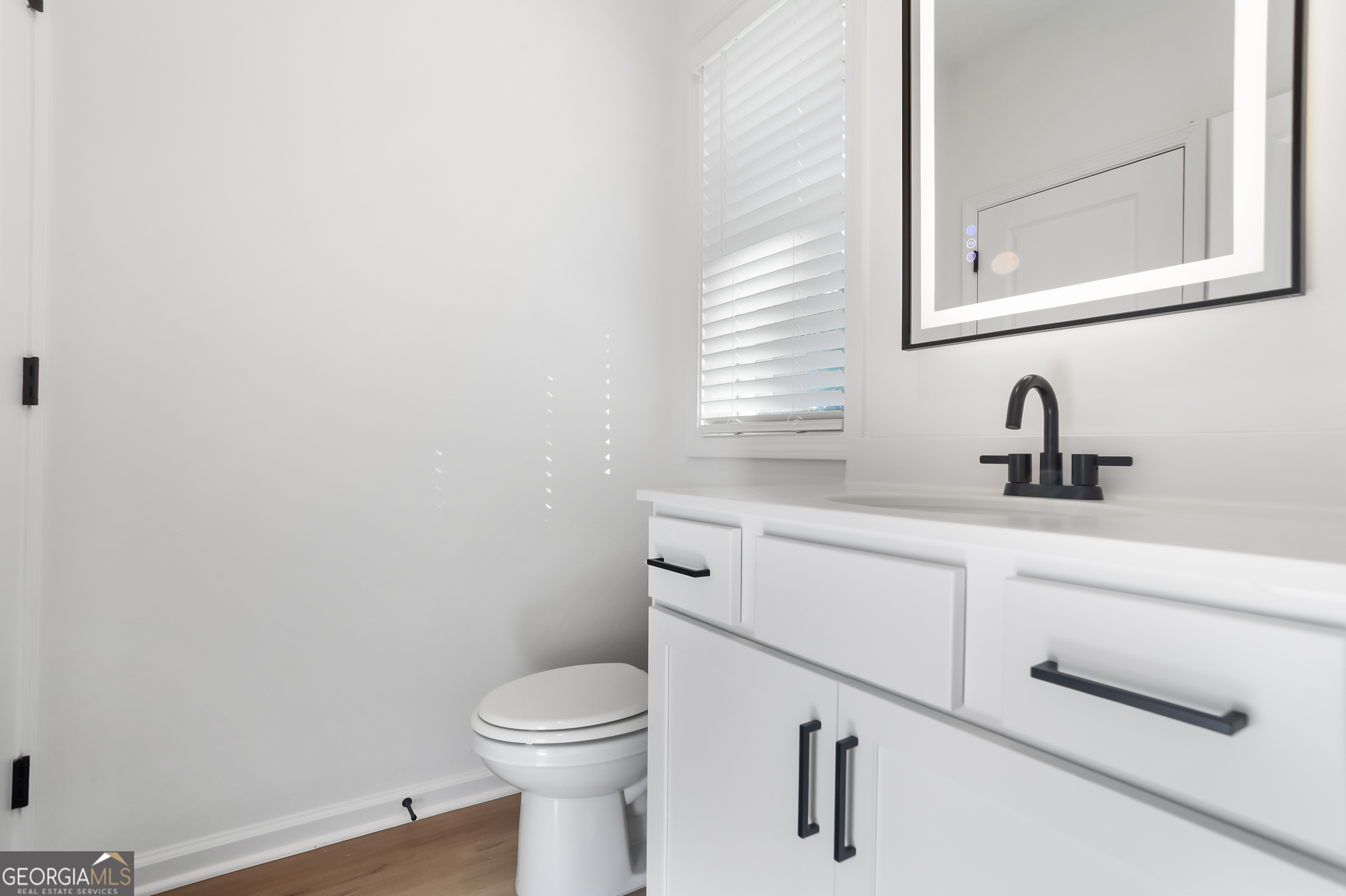 183 Jackson Heights, Unit 4 Cleveland, GA 30528 - Photo 10 of 28 1/2 bath on the first floor. There is also a linen closet.