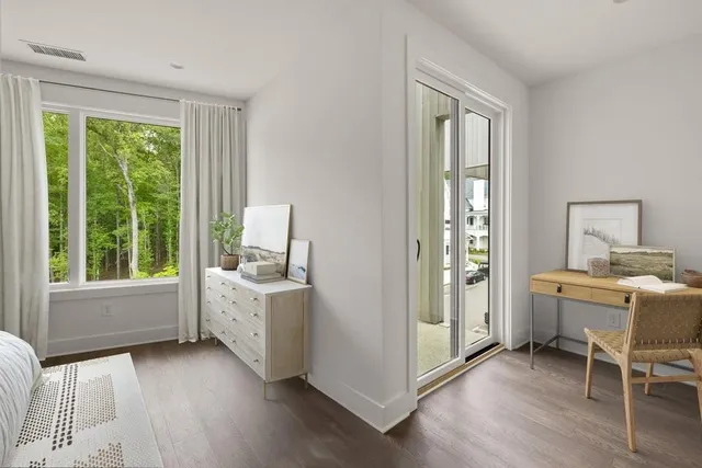 a view of kitchen with workspace and windows