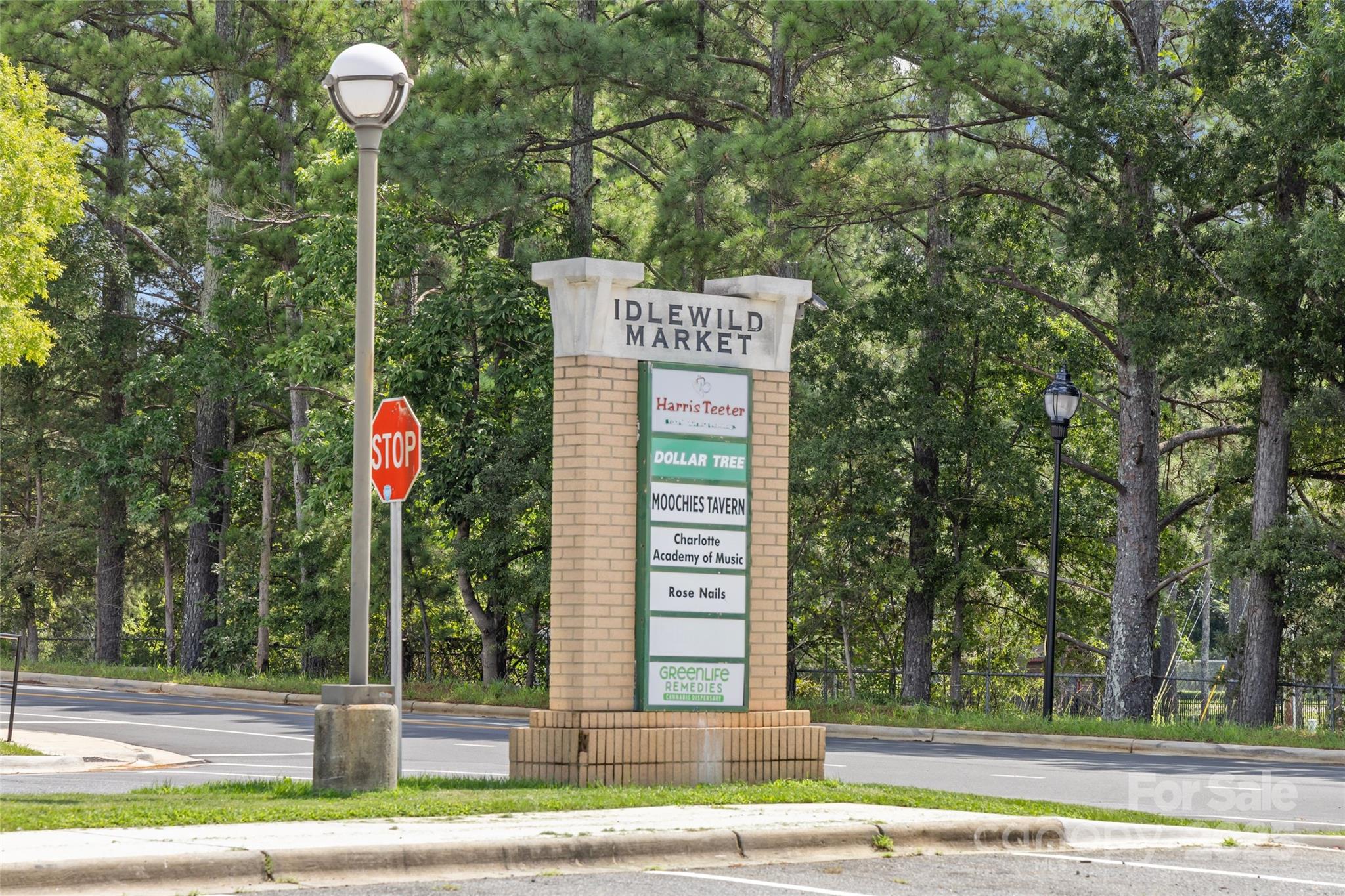 3017 Stevens Schultz Lane Matthews, NC 28104 - Photo 15 of 23 a sign that is on the side of a road