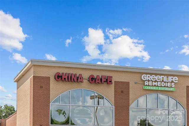 a view of a house with wooden deck