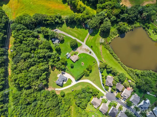 a view of a lake with a flower garden
