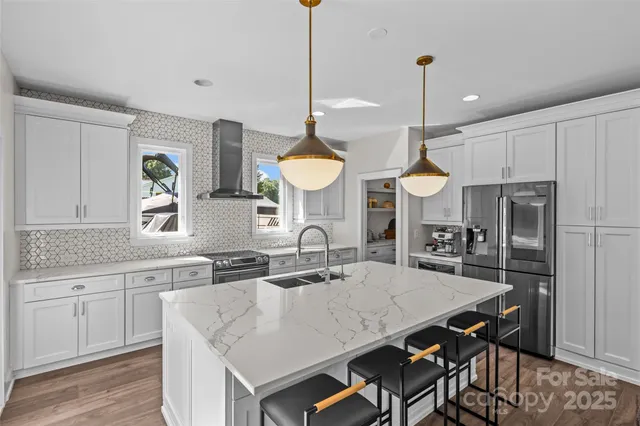 a bathroom with a bathtub a shower a sink and mirror