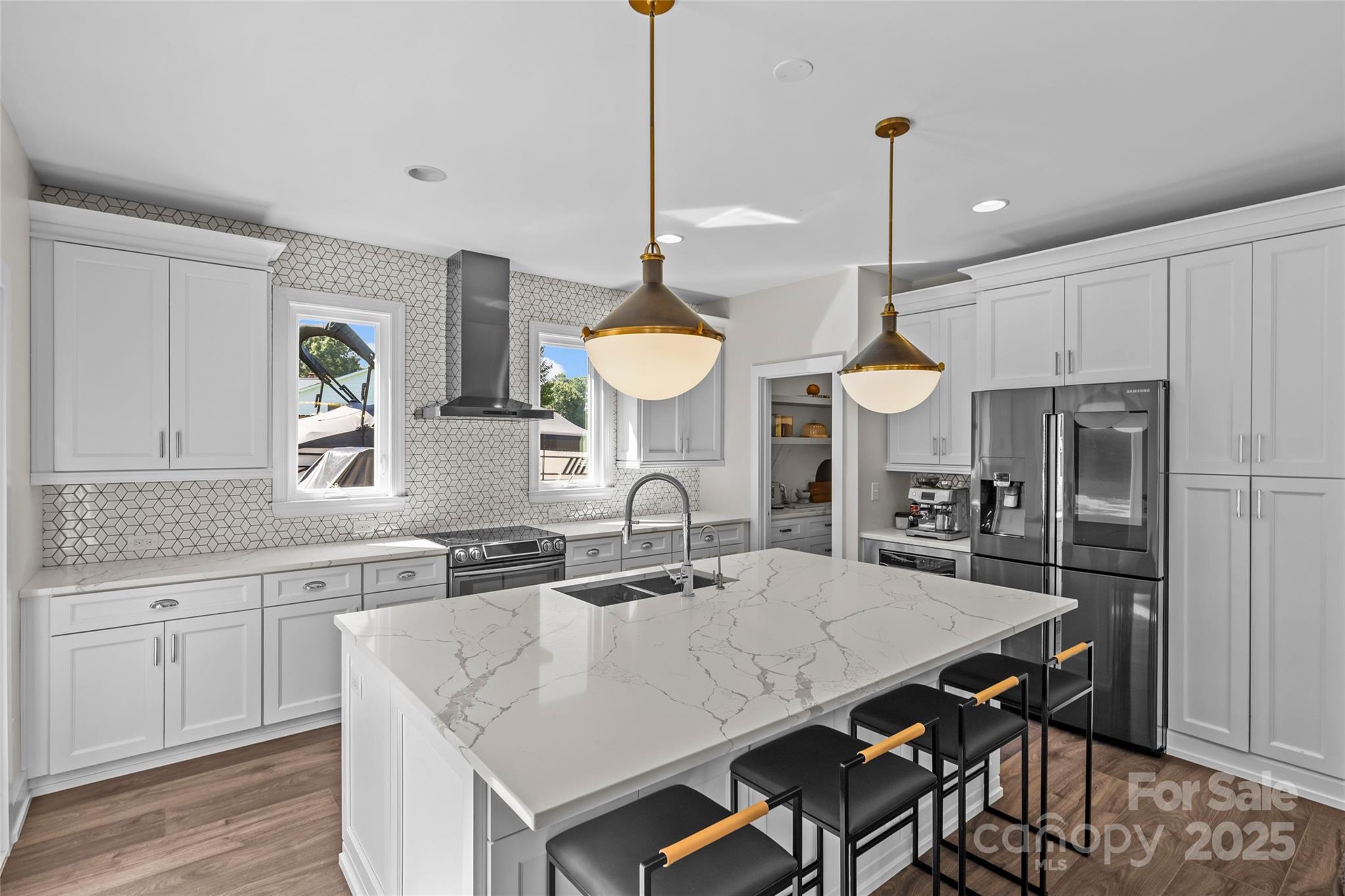 3017 Stevens Schultz Lane Matthews, NC 28104 - Photo 10 of 23 a kitchen with a table a sink and cabinets