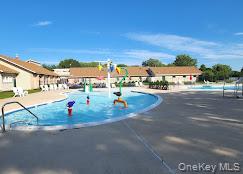 49 Pointe Circle South, Unit 49 Coram, NY 11727 - Photo 15 of 16 a view of a street