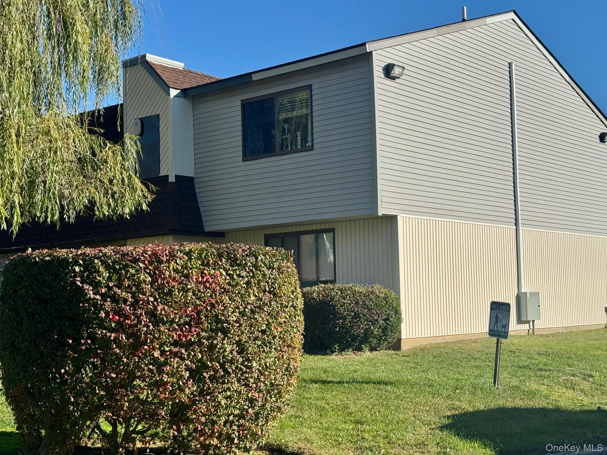 49 Pointe Circle South, Unit 49 Coram, NY 11727 - Photo 16 of 16 a view of a backyard of the house