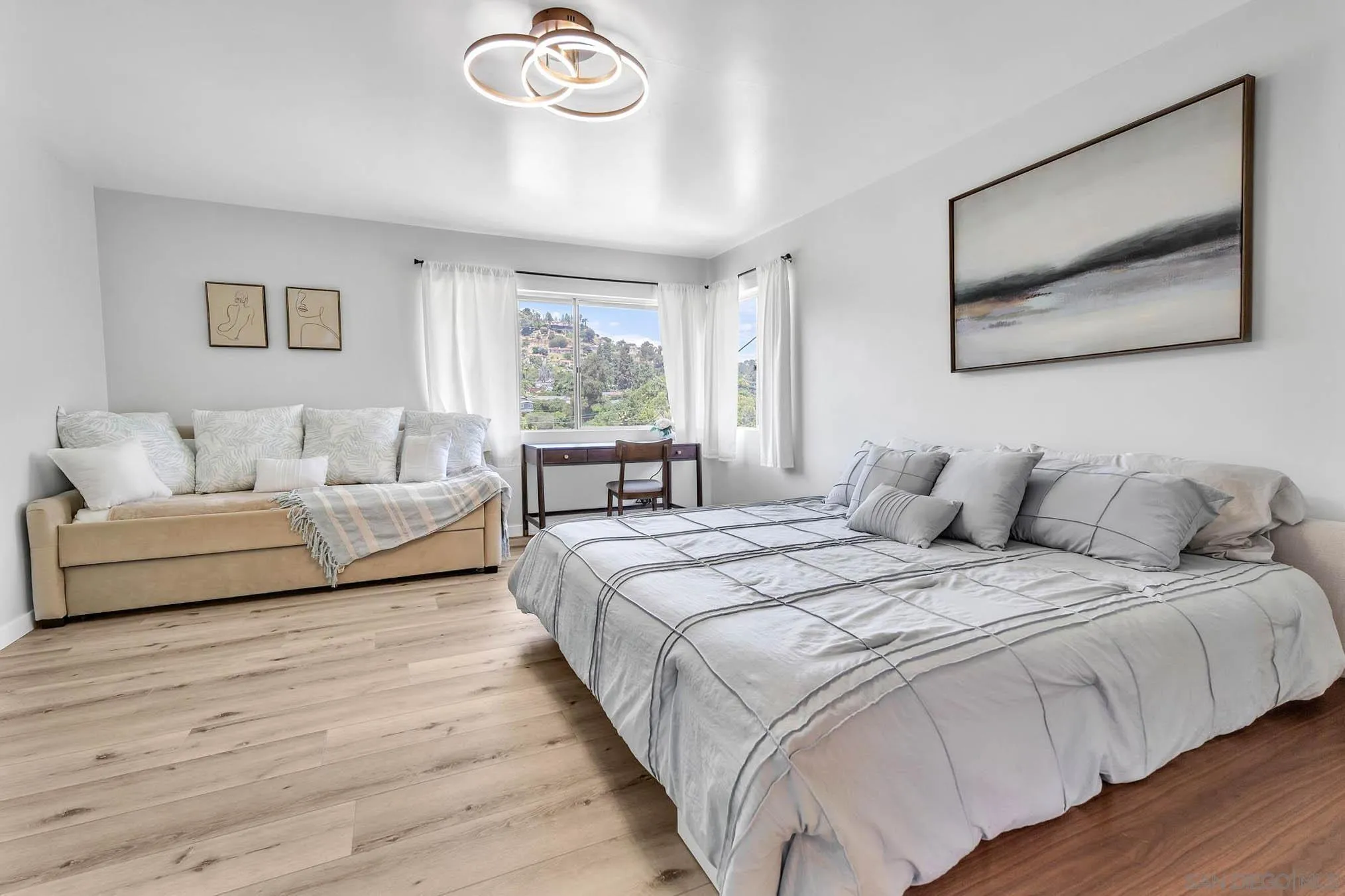 9817 Edgar Place La Mesa, CA 91941 - Photo 18 of 47 a spacious bedroom with a large bed and a couch