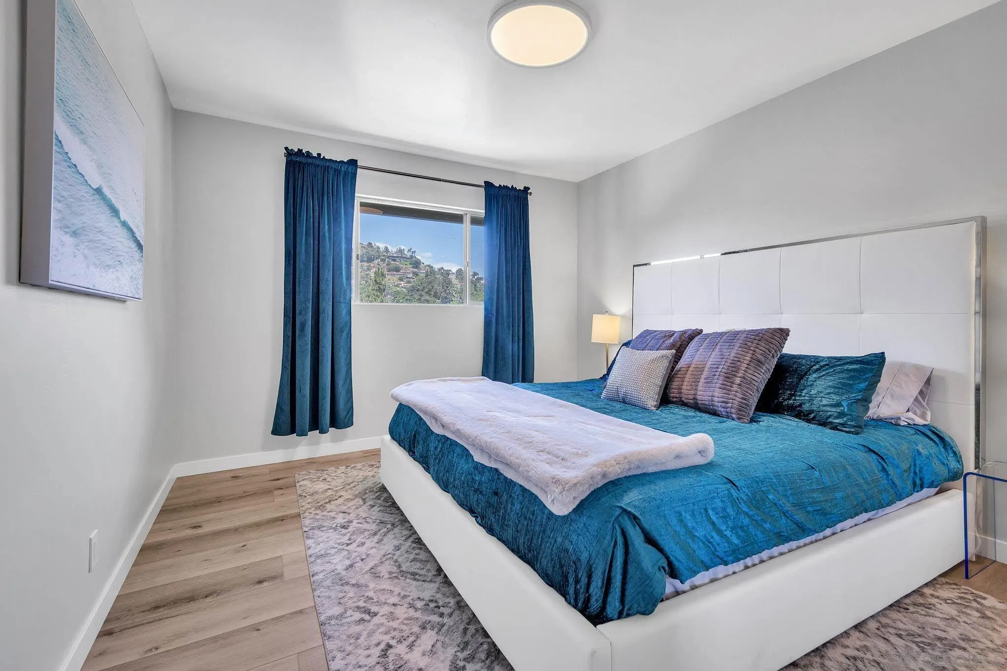 9817 Edgar Place La Mesa, CA 91941 - Photo 21 of 47 a bedroom with a large bed and a window