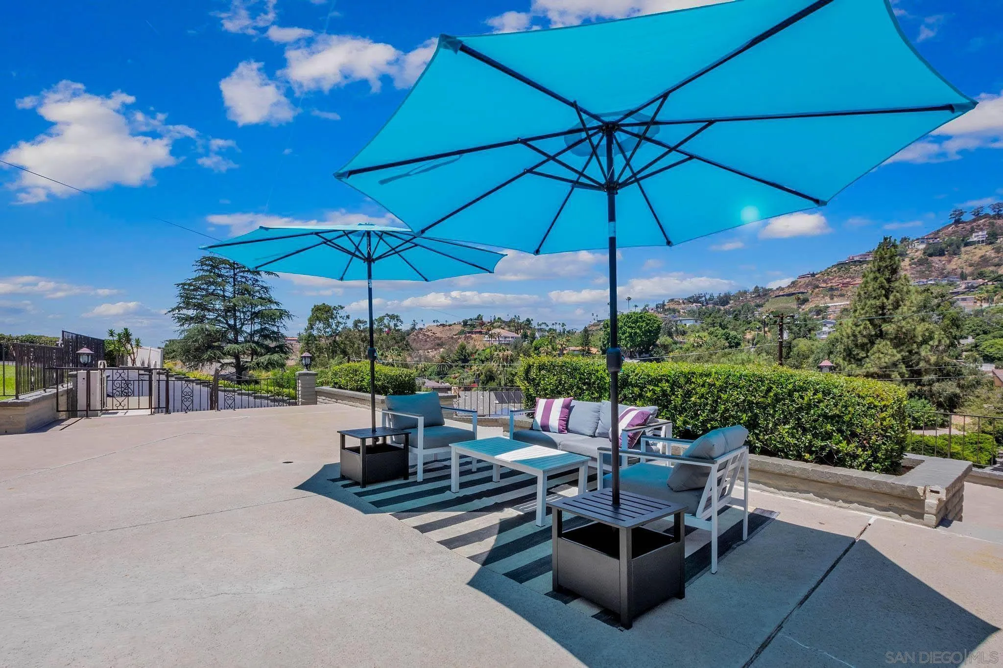 9817 Edgar Place La Mesa, CA 91941 - Photo 33 of 47 a view of a patio with a table and chairs under an umbrella