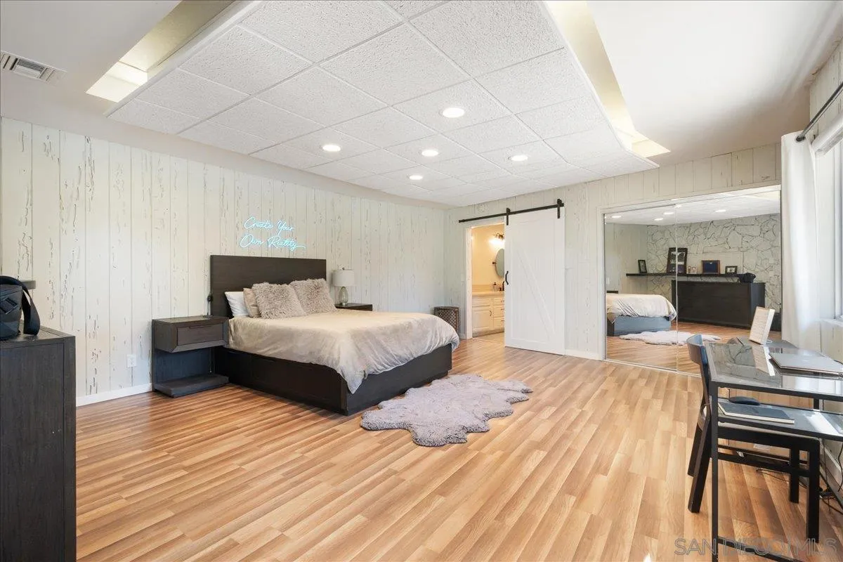 9817 Edgar Place La Mesa, CA 91941 - Photo 39 of 47 a bedroom with a bed and wooden floor