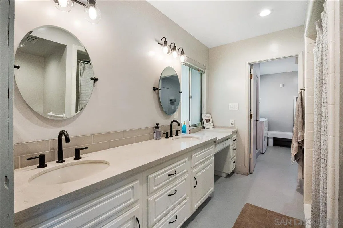 9817 Edgar Place La Mesa, CA 91941 - Photo 41 of 47 a spacious bathroom with a double vanity sink double and mirror