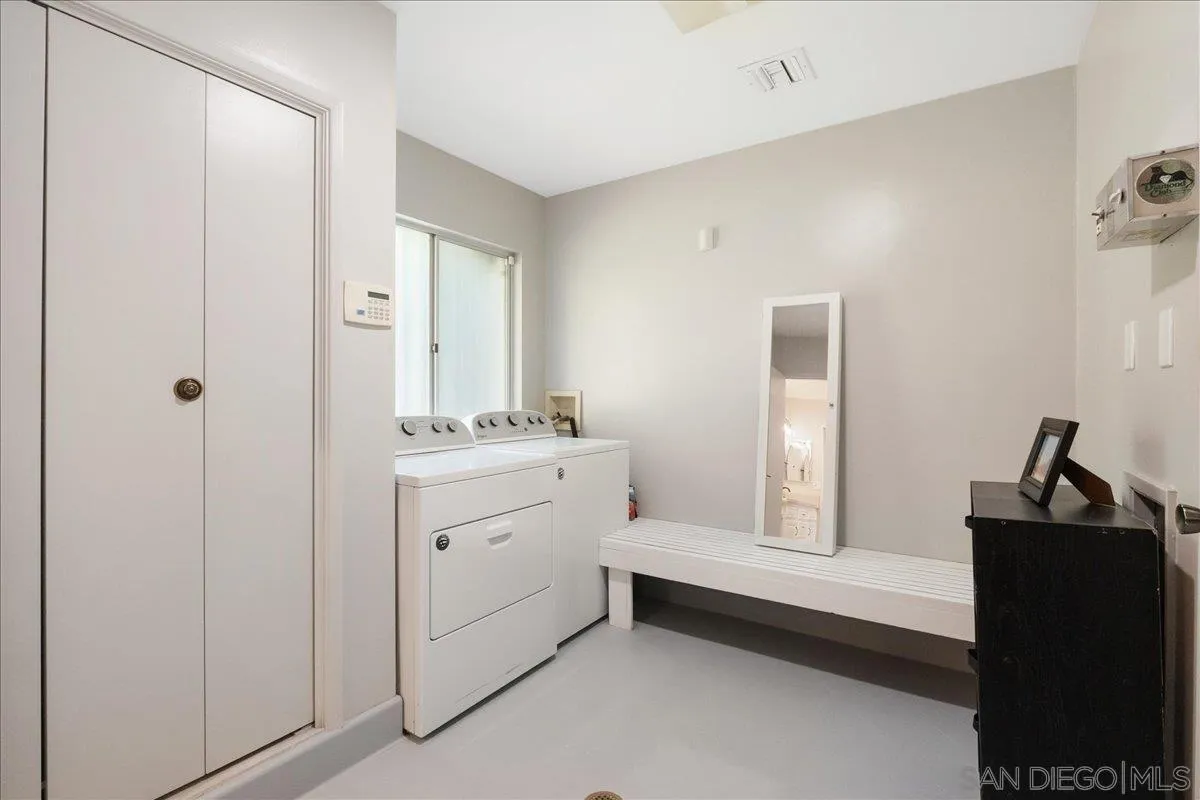 9817 Edgar Place La Mesa, CA 91941 - Photo 42 of 47 a bathroom with a double vanity sink and mirror