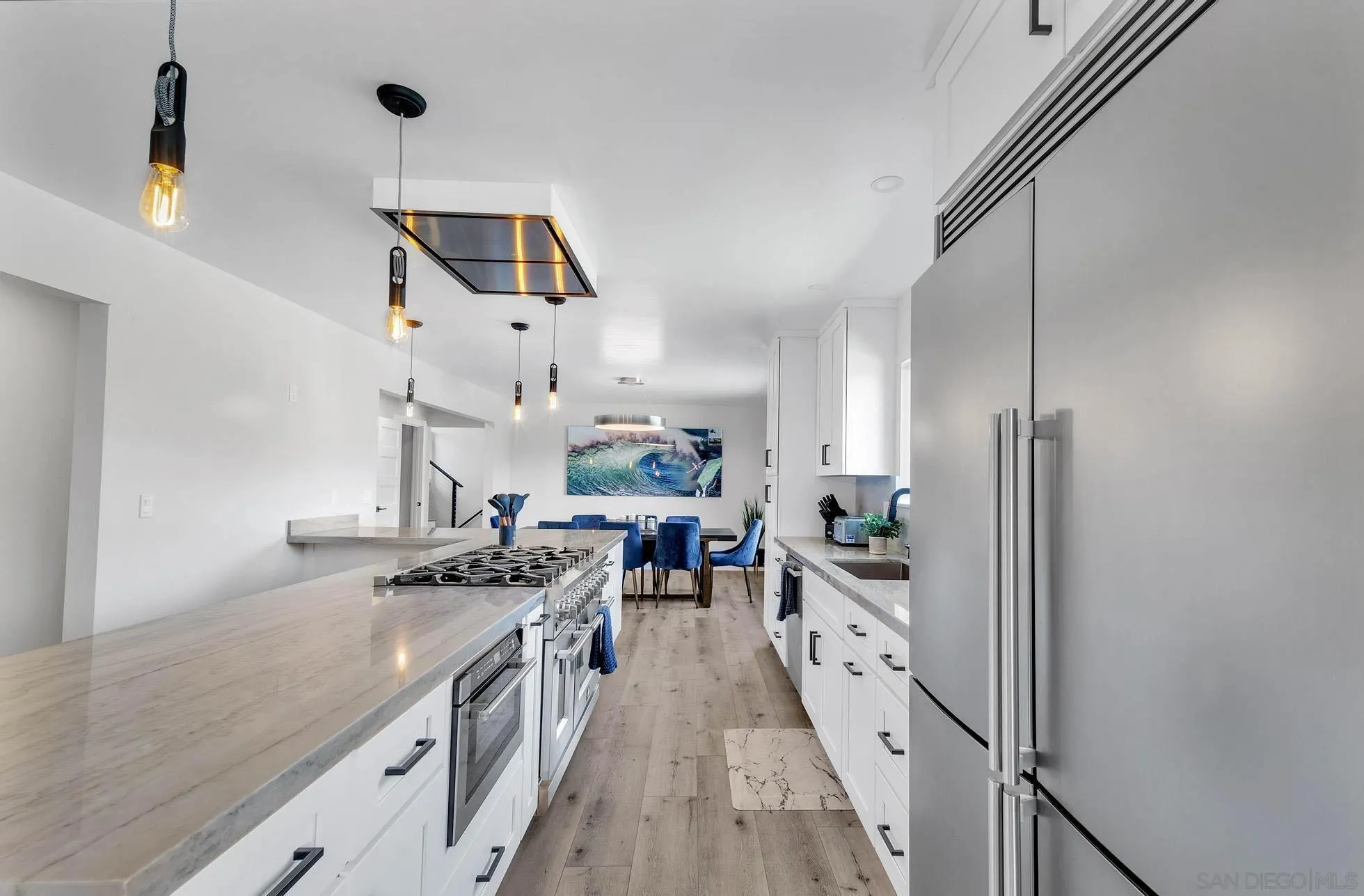 9817 Edgar Place La Mesa, CA 91941 - Photo 7 of 47 a kitchen with stainless steel appliances granite countertop a stove and a refrigerator