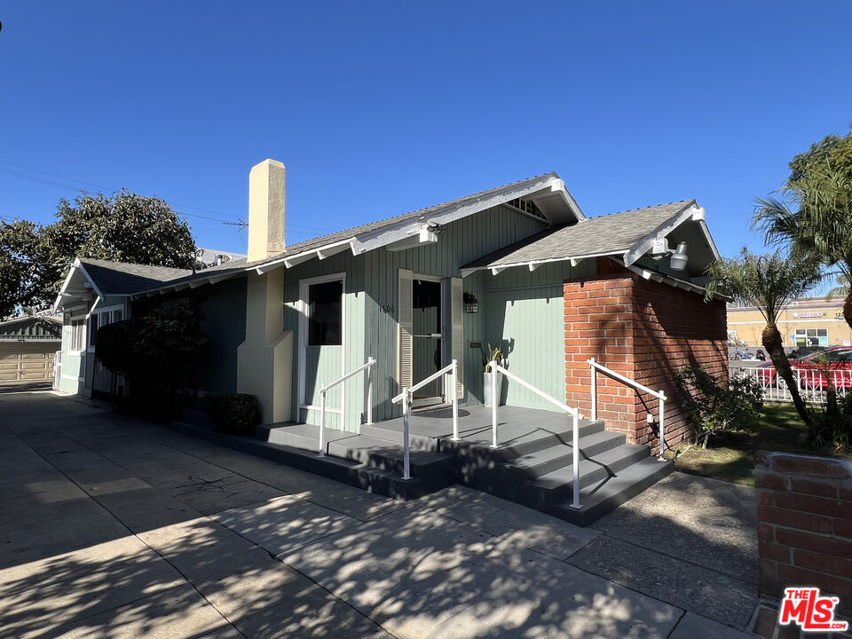 1606 North Bush Street Santa Ana, CA 92706 - Photo 2 of 13 a front view of a house with a yard