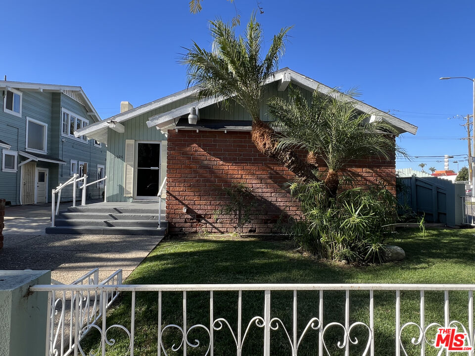 1606 North Bush Street Santa Ana, CA 92706 - Photo 3 of 13 a front view of a house with a yard