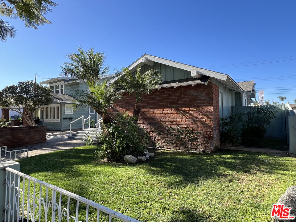1606 North Bush Street Santa Ana, CA 92706 - Photo 4 of 13 a view of a house with a yard and plants