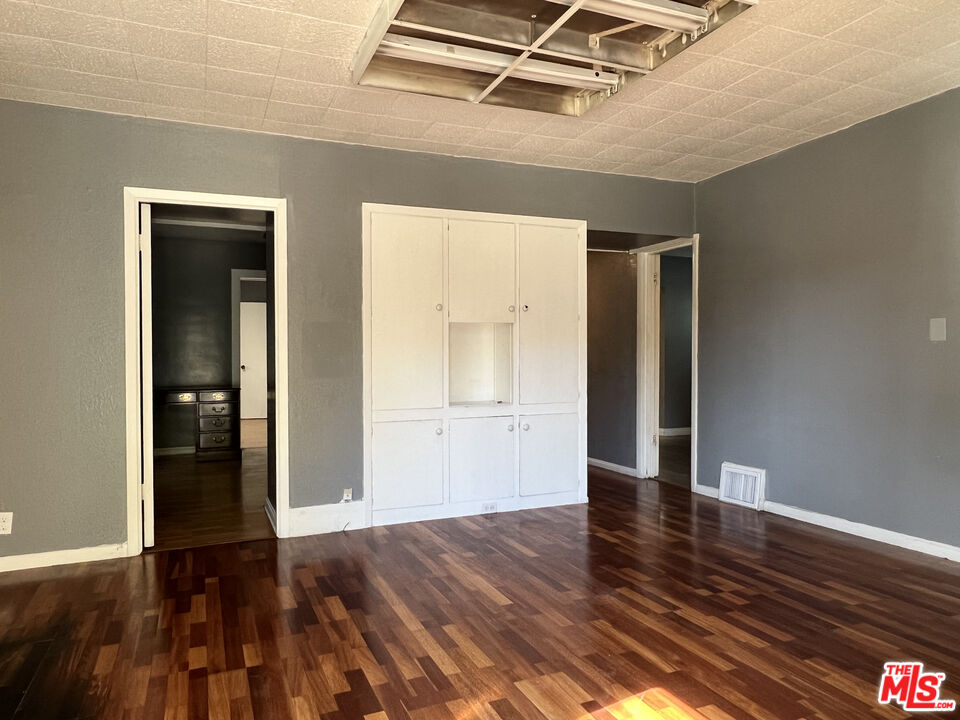 1606 North Bush Street Santa Ana, CA 92706 - Photo 6 of 13 a view of an empty room with wooden floor