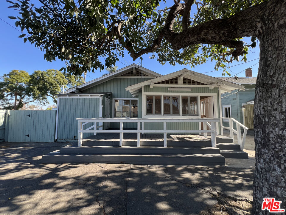 1606 North Bush Street Santa Ana, CA 92706 - Photo 10 of 13 a front view of a house with a tree