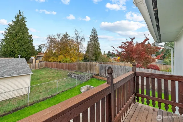 a view of a deck and yard