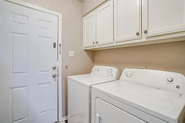 a view of a workspace with furniture and a kitchen