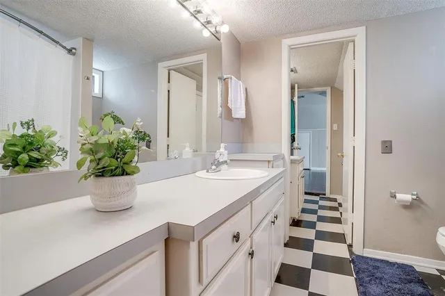 a bedroom with a bed and a desk