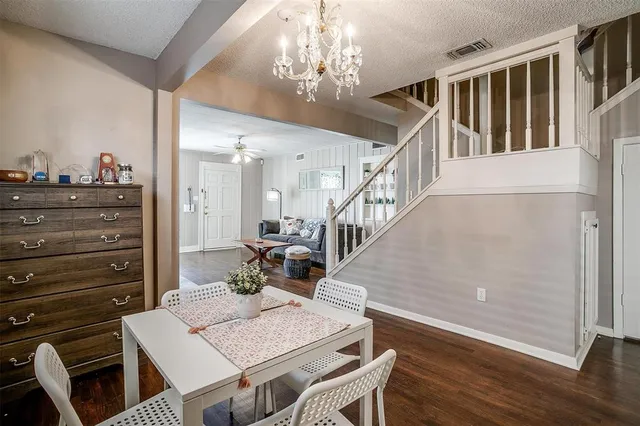 a kitchen with a refrigerator a sink and a window