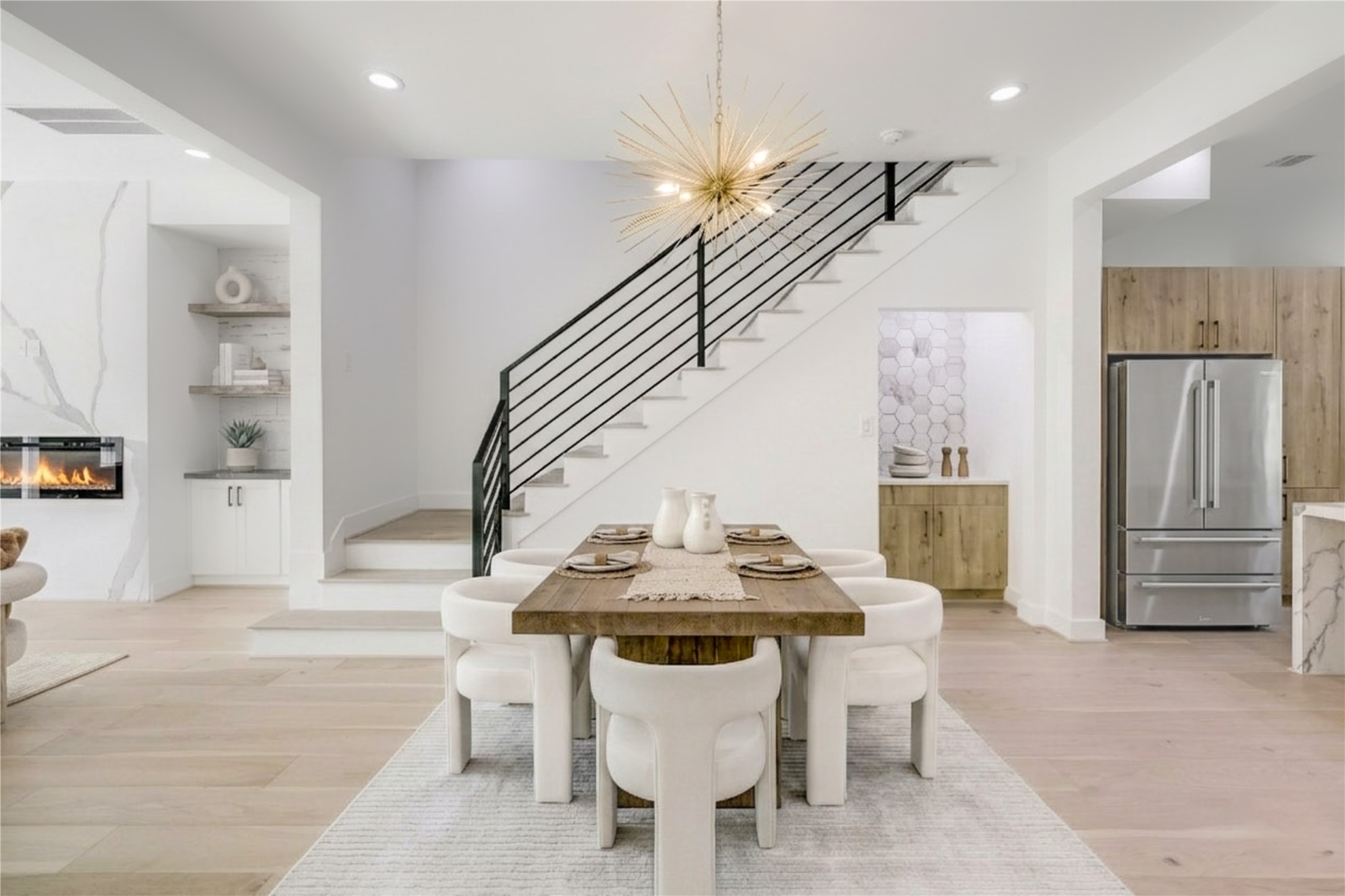 6209 Westcott Street Houston, TX 77007 - Photo 4 of 16 Dining - features a custom designer lighting fixture and a dry bar with quartz countertop.
