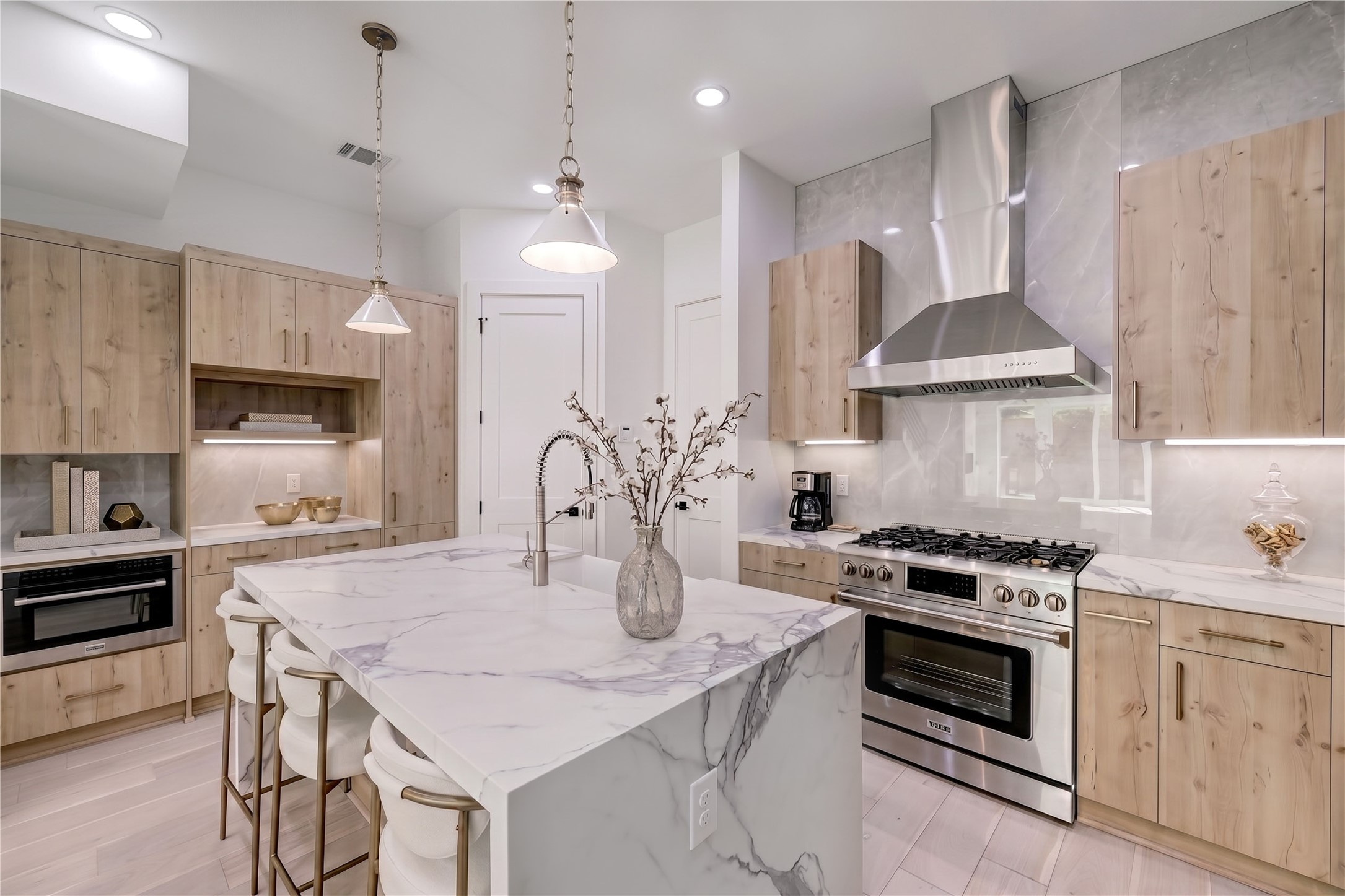 6209 Westcott Street Houston, TX 77007 - Photo 5 of 16 Kitchen features stainless steel appliances, custom pendants and porcelain tile backsplash.