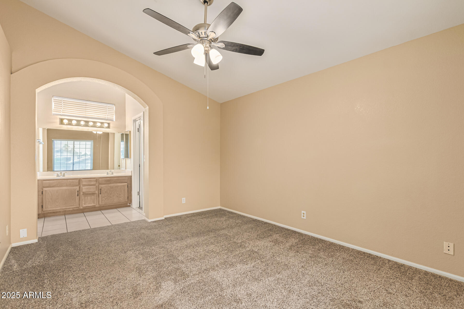 1132 East Hearne Way Gilbert, AZ 85234 - Photo 19 of 32 an empty room with windows and fan