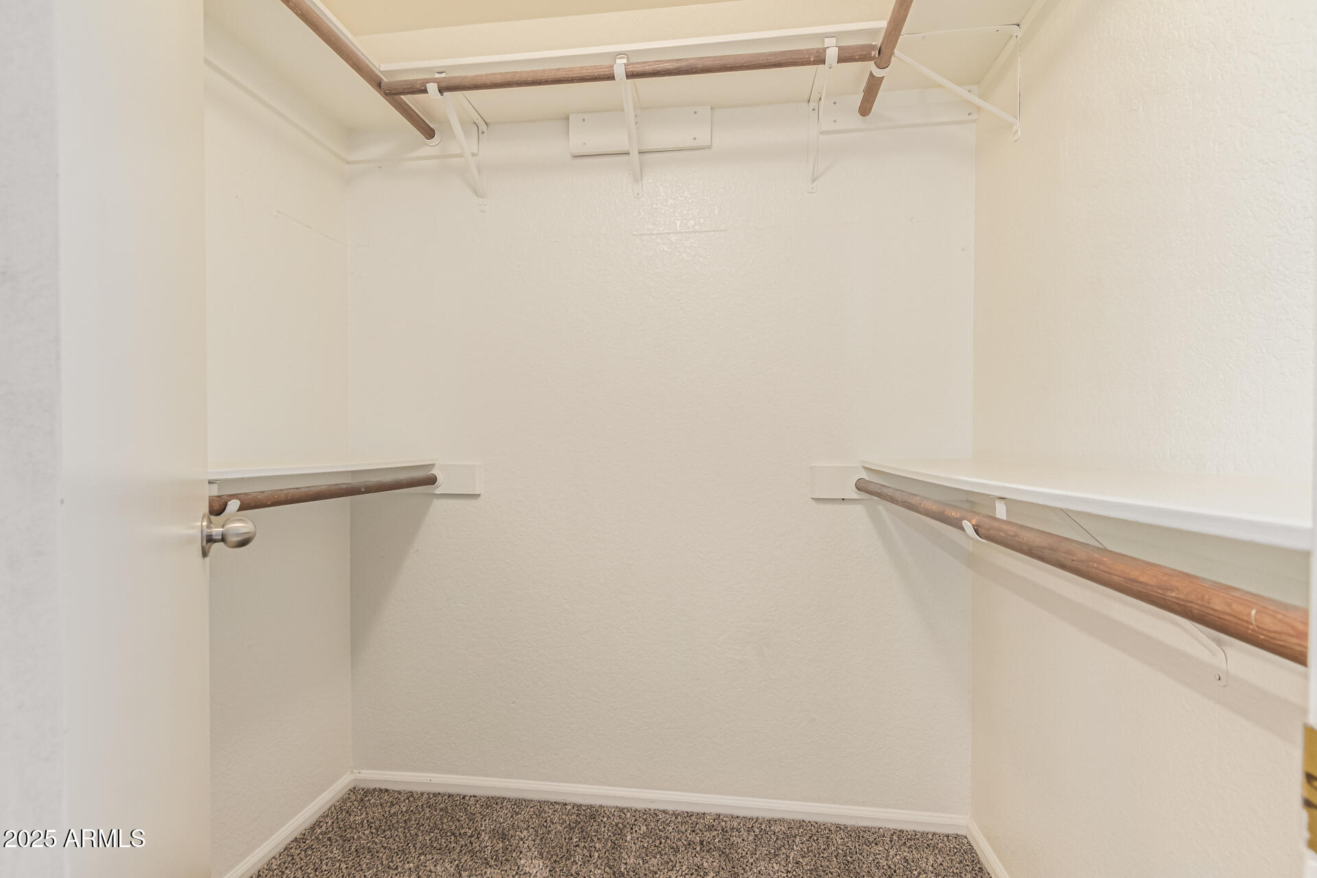 1132 East Hearne Way Gilbert, AZ 85234 - Photo 22 of 32 a view of a room with racks on the wall