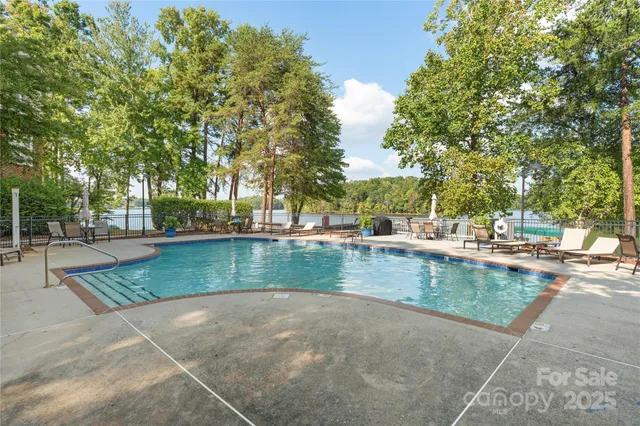 a view of a swimming pool with a patio