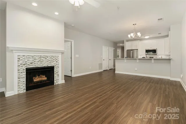 a view of a kitchen with furniture and a fireplace