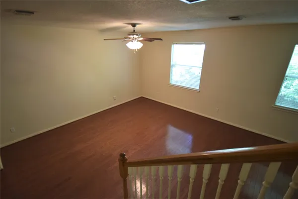 a view of a hallway with a window