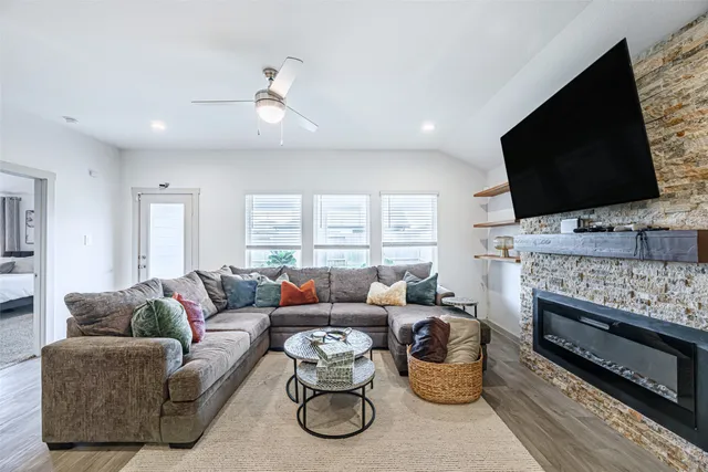 a living room with furniture and a flat screen tv