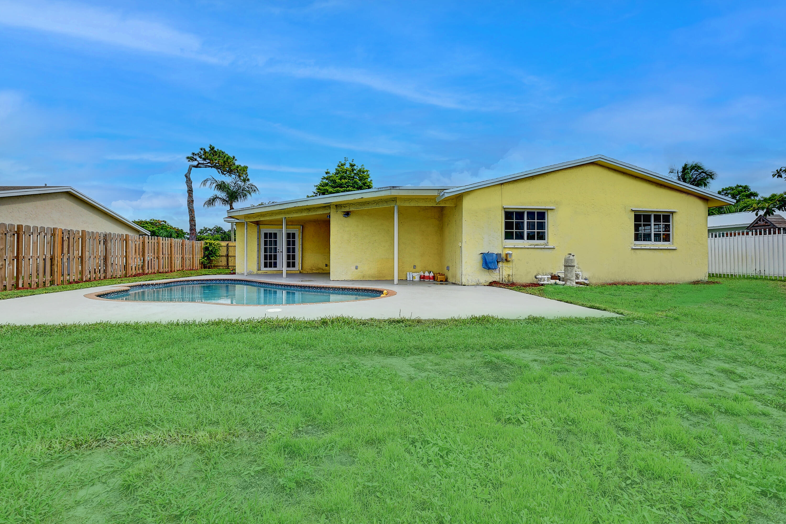 1775 Southwest 8th Street Boca Raton, FL 33486 - Photo 20 of 20 a front view of a house with a yard