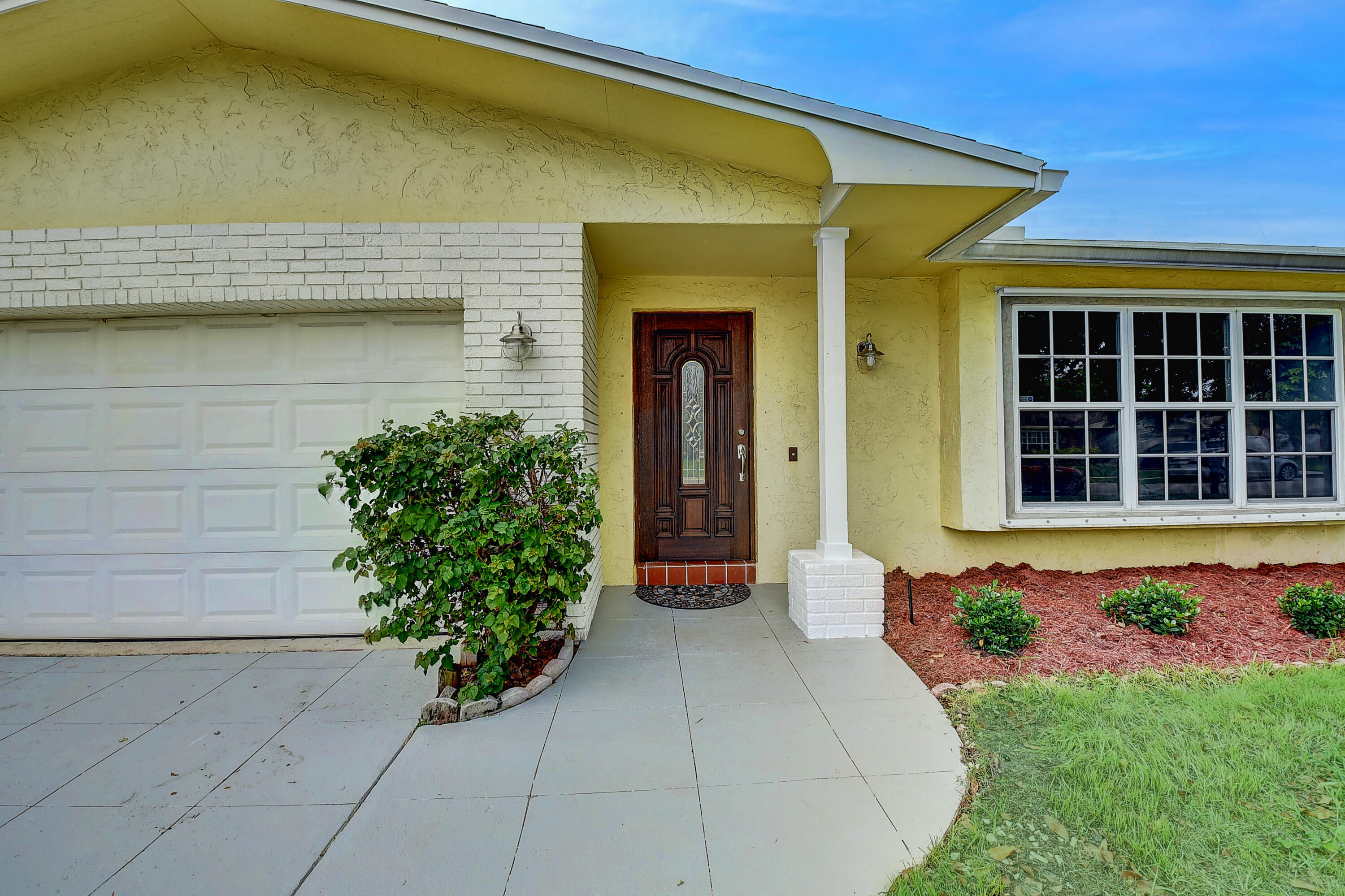 1775 Southwest 8th Street Boca Raton, FL 33486 - Photo 2 of 20 a front view of a house