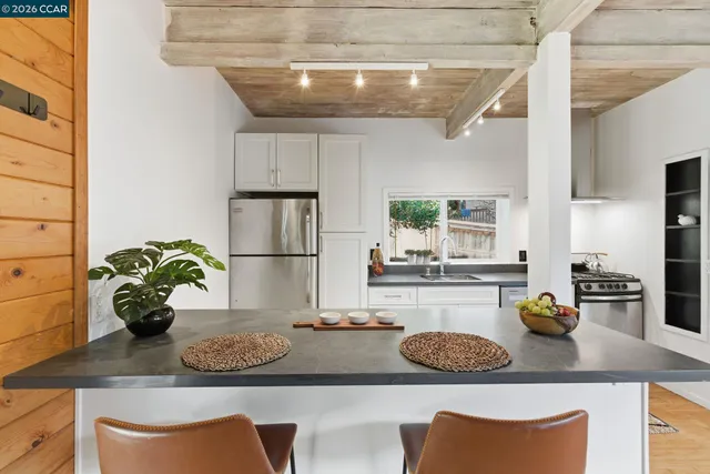 a kitchen with a table and chairs in it