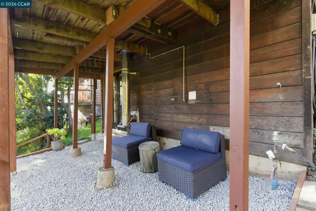 a outdoor living space with furniture and a garden