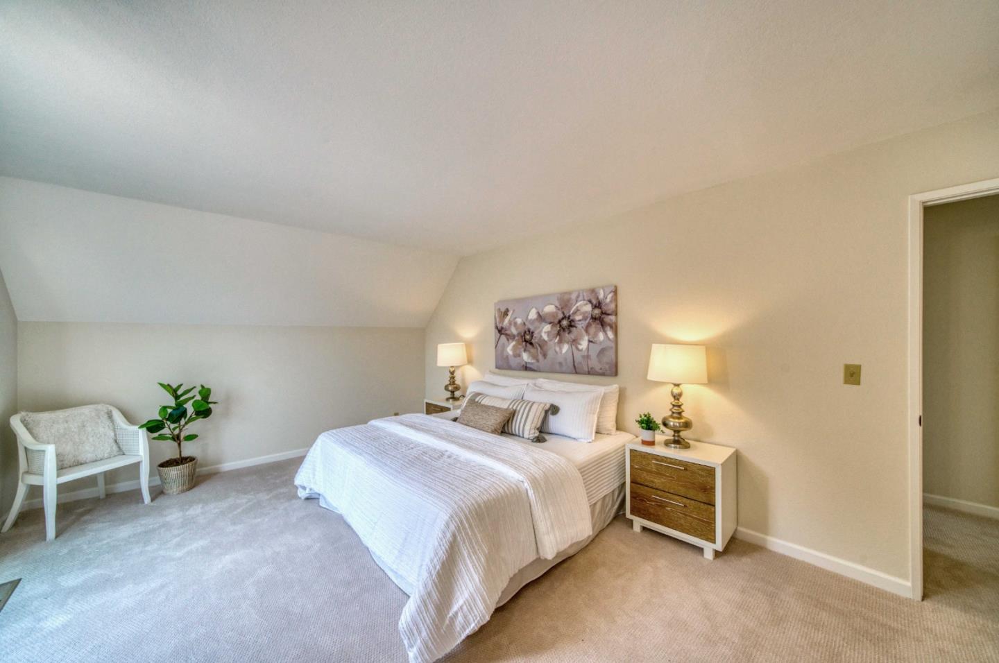 457 Roberts Road Pacifica, CA 94044 - Photo 15 of 29 a bedroom with a bed and a table in it